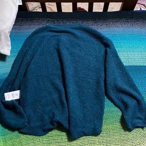 Very soft fuzzy light weight sweater. Can be a shirt or extra layer.
